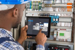 A control technologies service technician performing routine systems maintenance and repair