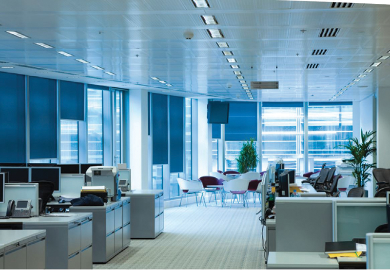 An office building interior showing optimized and connected lighting controls, energy saving solutions.
