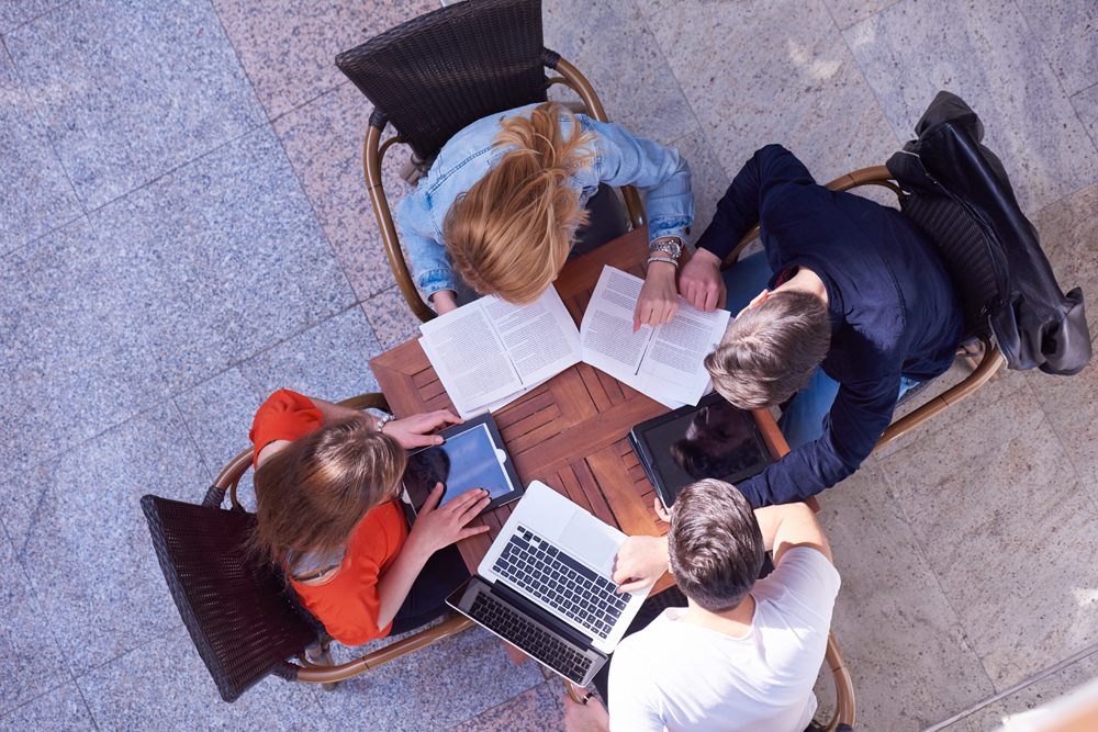 College students studying comfortably in an educational facility with efficient building automation systems.